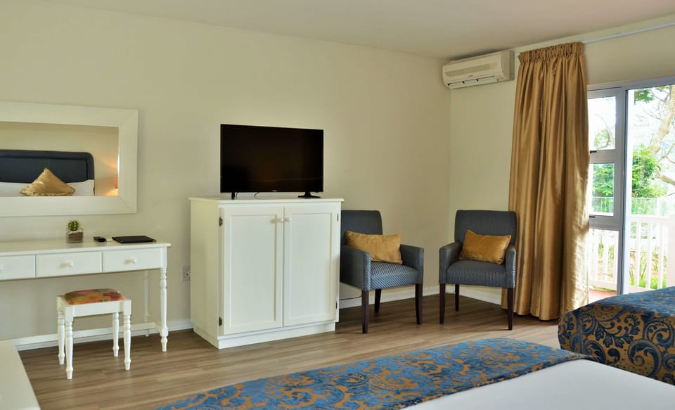 Standard Double Room, 1 Queen Bed, Patio, Lagoon View | Living area | TV