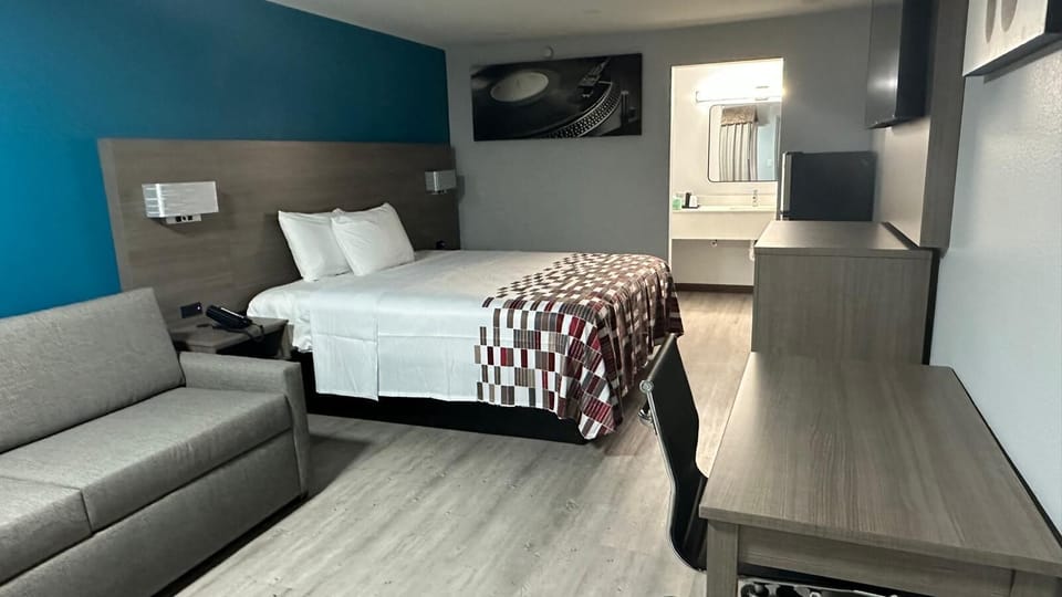 Premium bedding, desk, laptop workspace, free WiFi