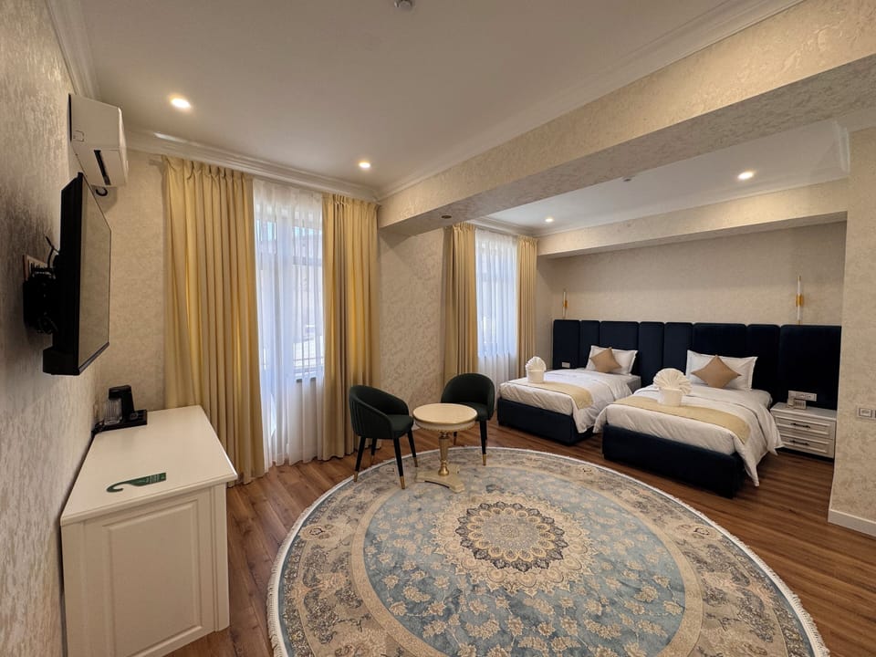 Deluxe Suite, City View | Premium bedding, minibar, in-room safe, desk
