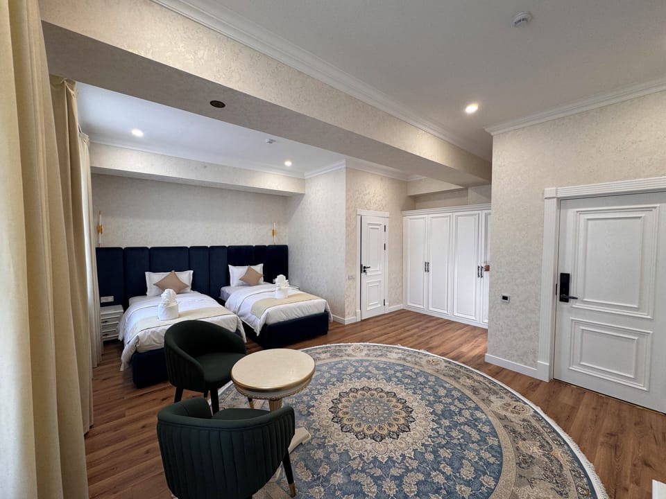 Deluxe Suite, City View | Premium bedding, minibar, in-room safe, desk