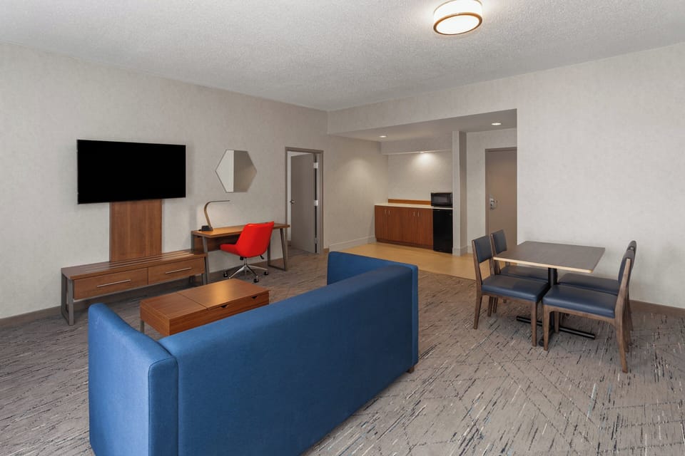Suite, 1 King Bed, Accessible (Communications) | Premium bedding, in-room safe, desk, iron/ironing board