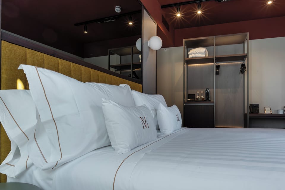 Deluxe Room, Partial Lake View | Down comforters, minibar, in-room safe, desk