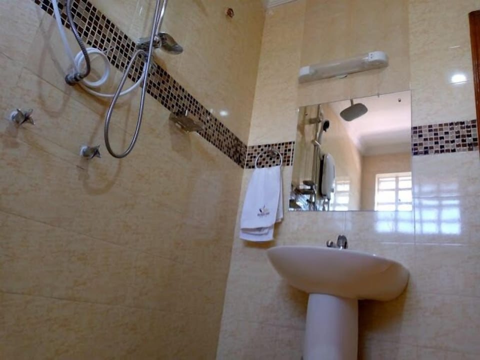 Shower, free toiletries, slippers, towels
