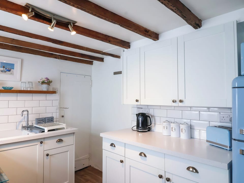 Fridge, microwave, toaster, cookware/dishes/utensils