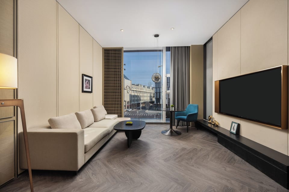 Moment Suites | Down comforters, minibar (free items), WiFi (free), bed sheets