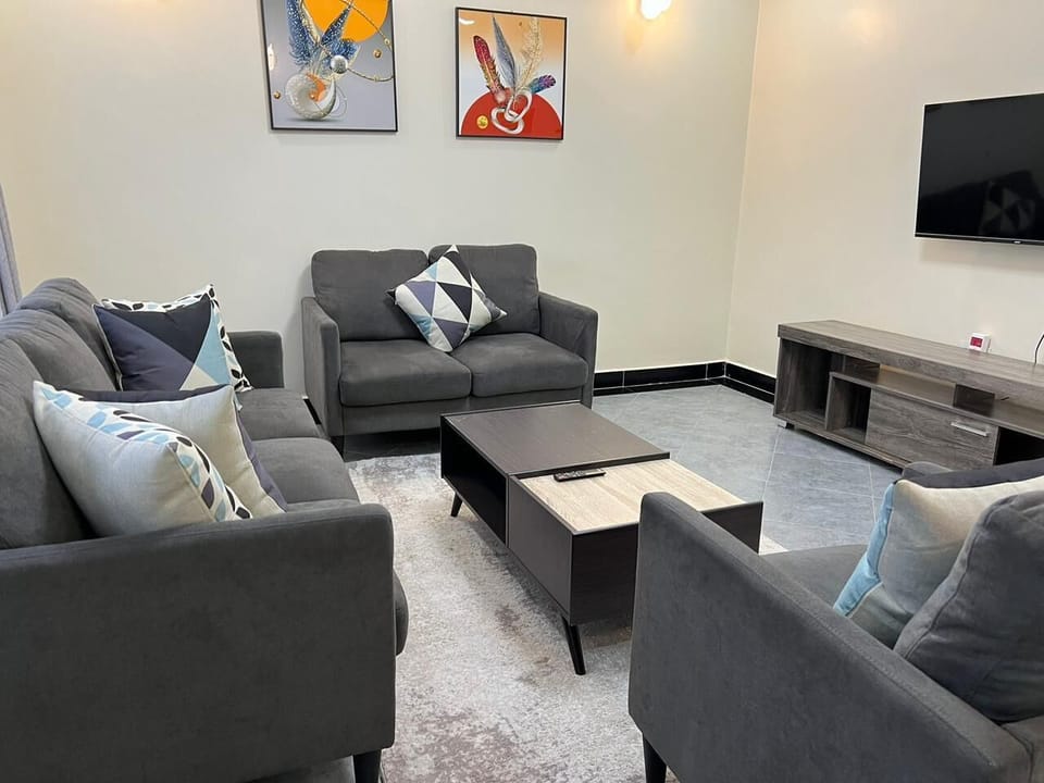 Deluxe Apartment, City View | Living area | 24-inch Smart TV with digital channels