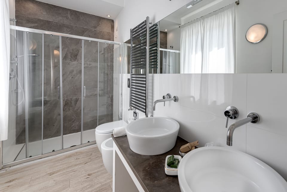 Shower, rainfall showerhead, designer toiletries, hair dryer