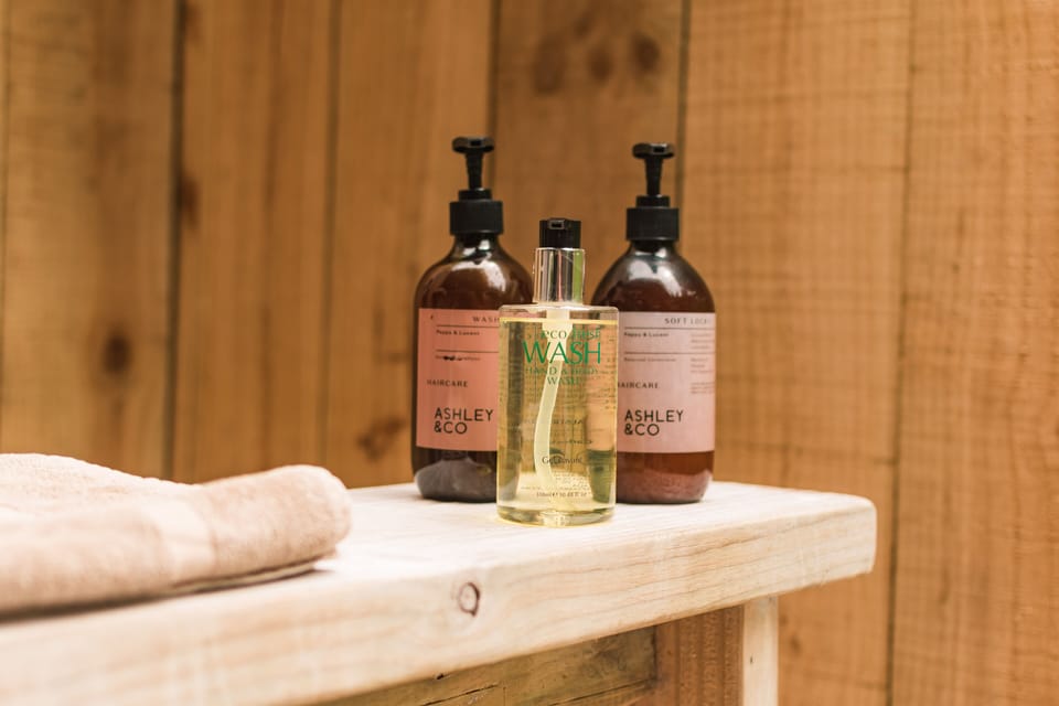 Designer toiletries, hair dryer, bathrobes, towels
