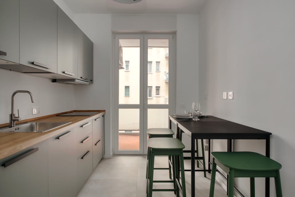 Apartment, 3 Bedrooms, Balcony, Courtyard View | Private kitchen | Electric kettle, dining tables