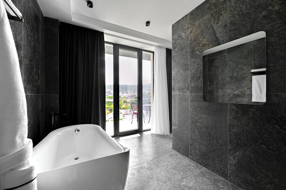 Luxury Double Room, Balcony, Mountain View | Bathroom | Hair dryer, slippers, towels, soap