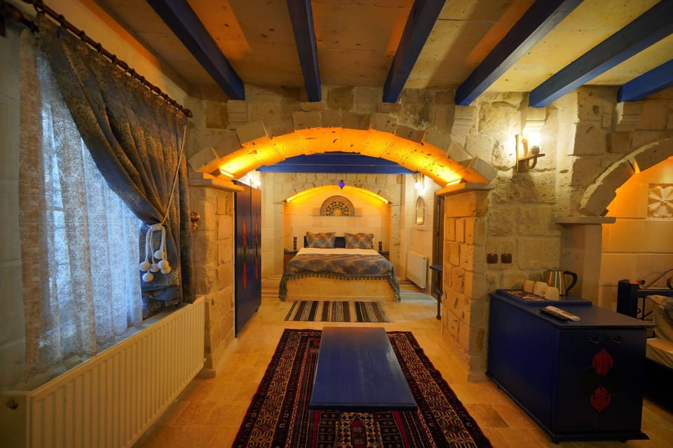 Deluxe Triple Room | Minibar, in-room safe, individually decorated, individually furnished