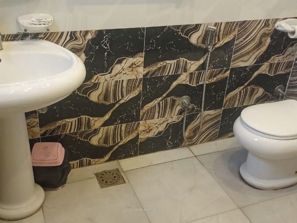 Separate tub and shower, towels, soap, shampoo