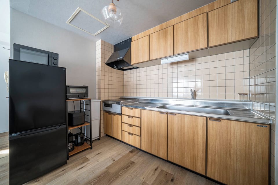 Full-size fridge, microwave, stovetop, toaster