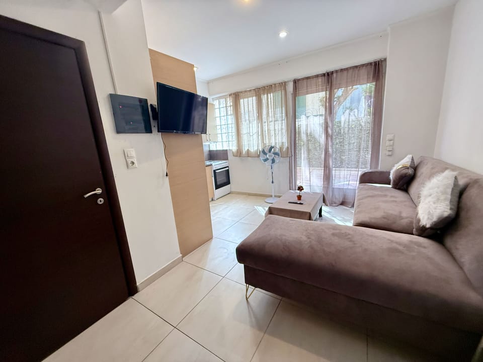 Apartment | Living area | 24-inch flat-screen TV with digital channels