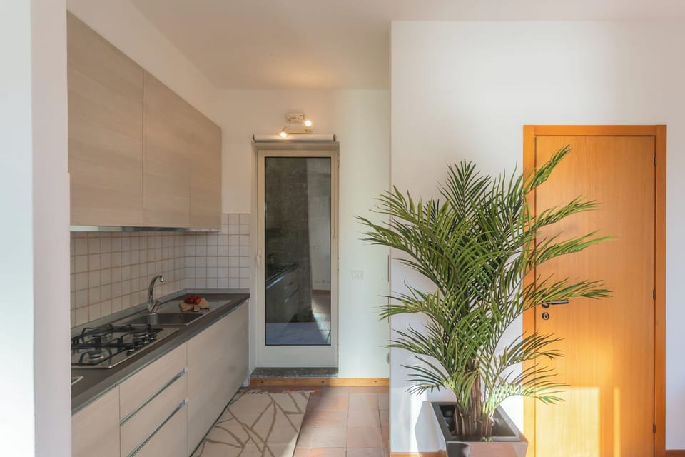 Apartment (2 Bedrooms) | Private kitchen | Microwave, espresso maker, electric kettle, highchair