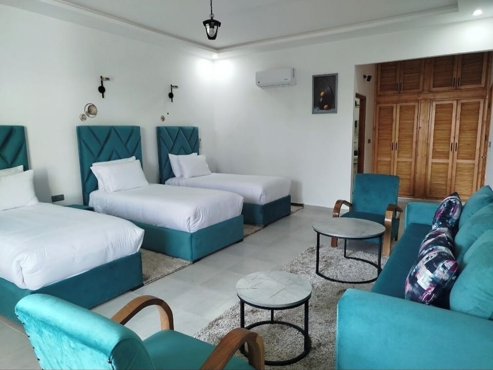 Luxury Triple Room, Pool View | Blackout drapes, free WiFi