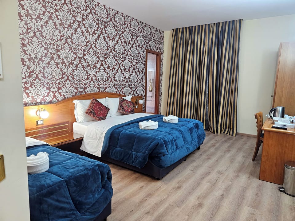 Deluxe Triple Room, City View | Desk, free WiFi