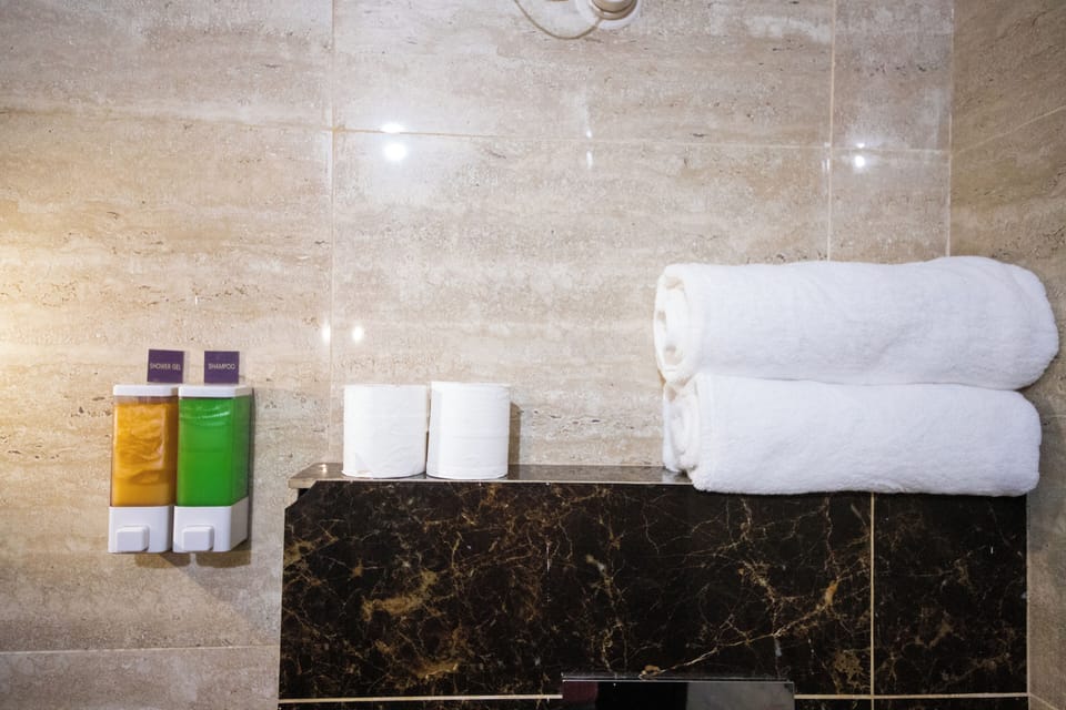 Executive Double Room, 1 King Bed, Balcony | Bathroom | Shower, towels, soap, shampoo
