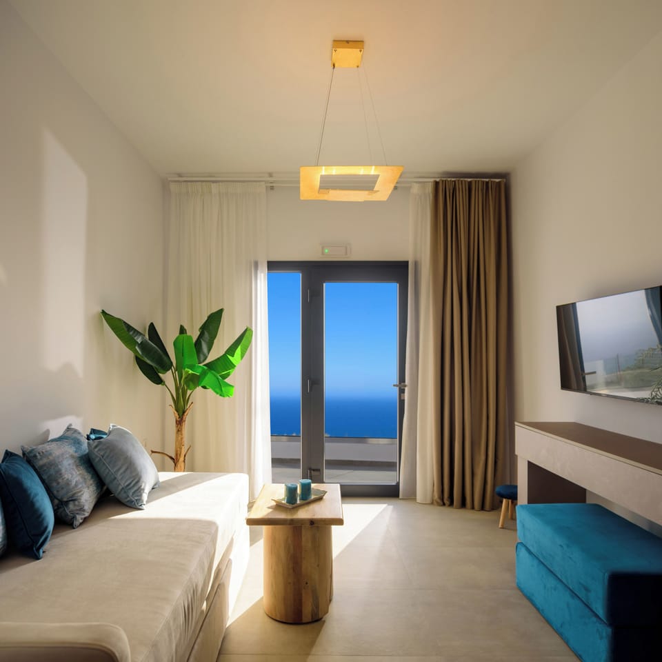 Suite, Balcony, Sea View | Living area | TV