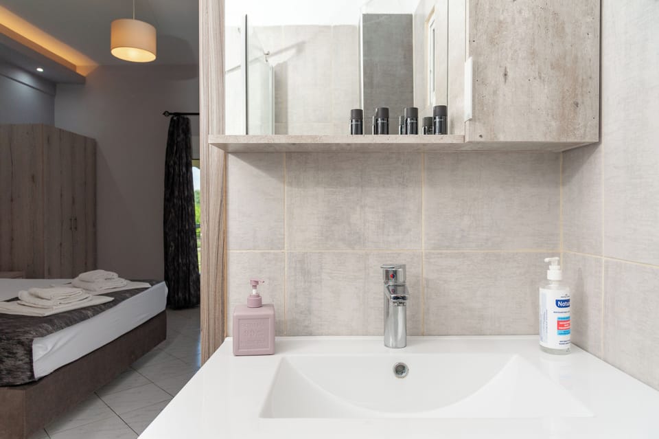 Family Quadruple Room, Balcony, Mountain View | Bathroom | Separate tub and shower, free toiletries, hair dryer, towels