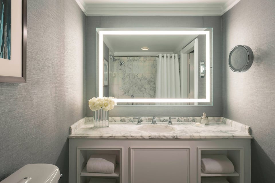 Combined shower/tub, designer toiletries, hair dryer, bathrobes