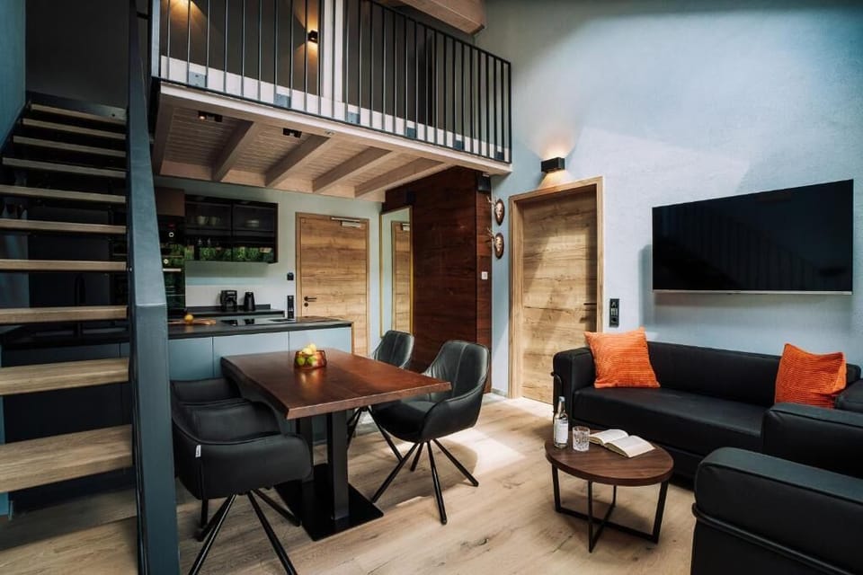Deluxe Suite, Balcony | Living area | Flat-screen TV, heated floors