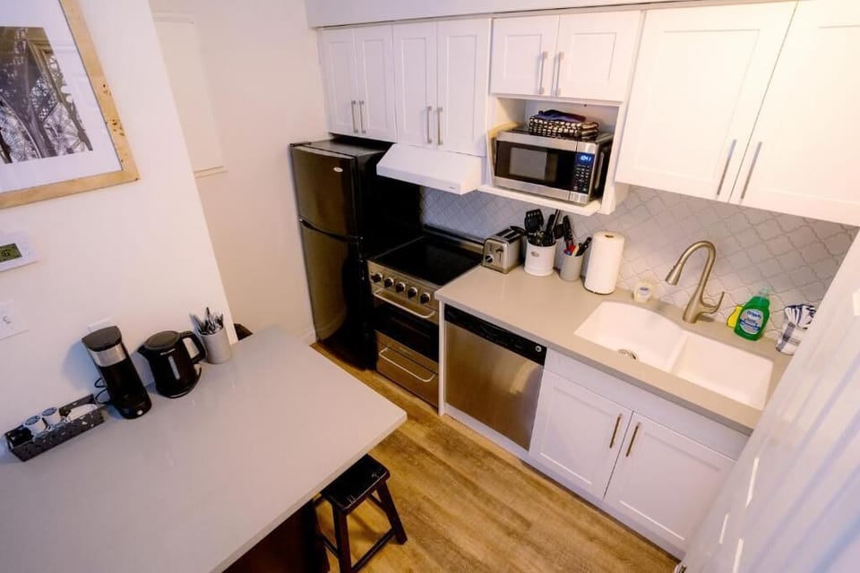 Standard Condo, Multiple Beds, Non Smoking, Balcony | Private kitchen | Coffee/tea maker, fridge, microwave, oven