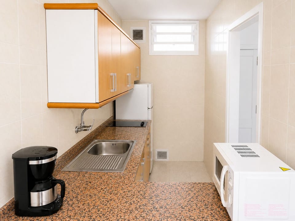Mini-fridge, microwave, stovetop, cookware/dishes/utensils