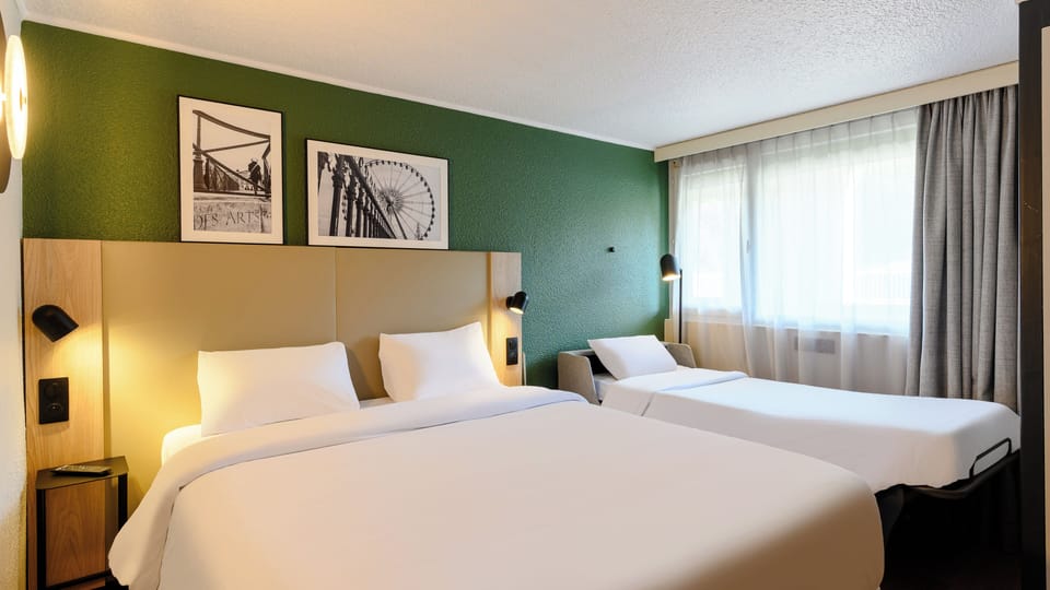 Premium bedding, blackout drapes, iron/ironing board