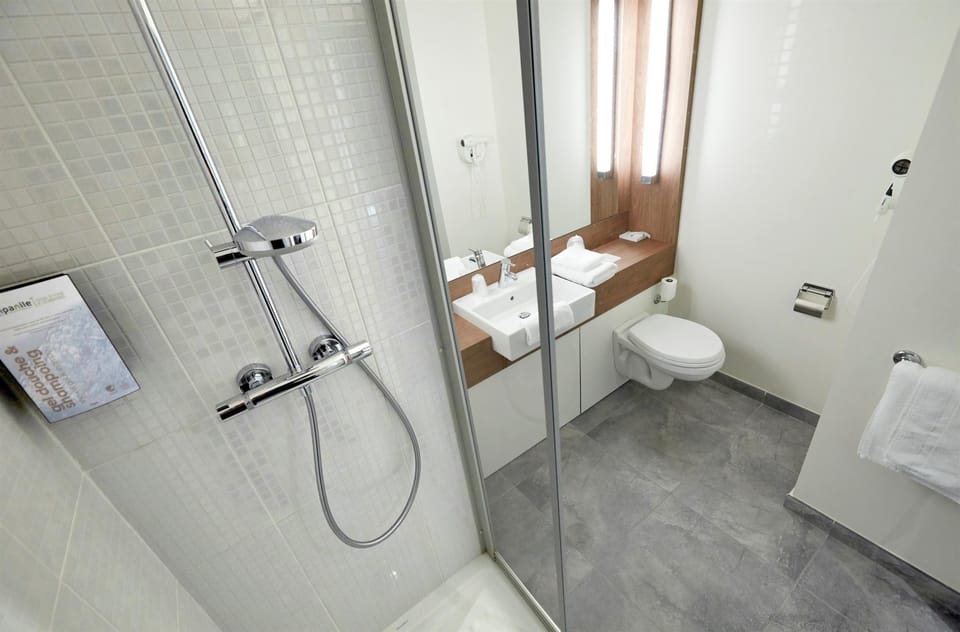 Shower, eco-friendly toiletries, hair dryer, towels