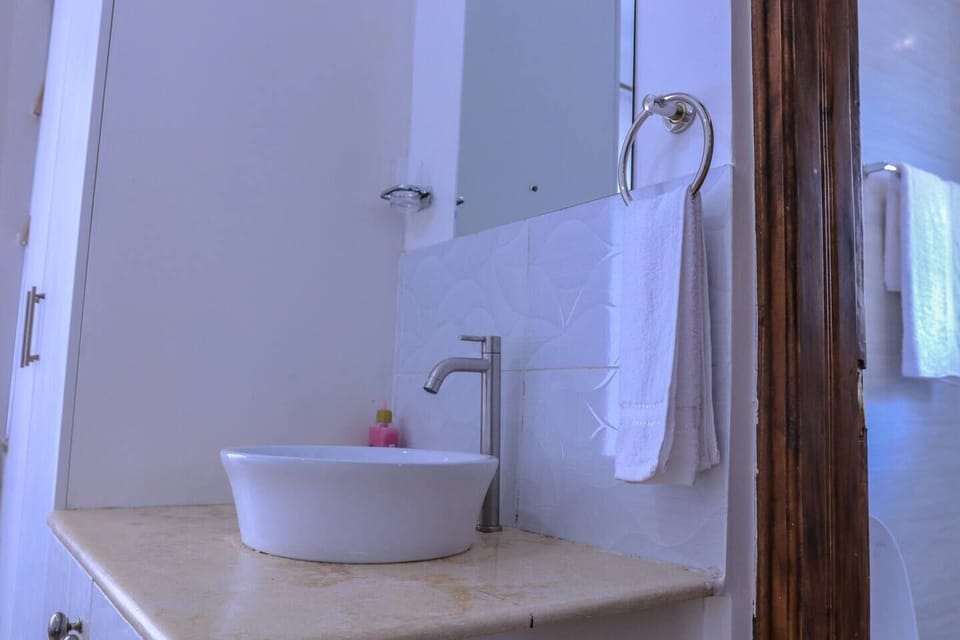 Family Villa | Bathroom | Shower, rainfall showerhead, hair dryer, slippers