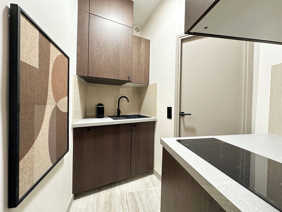 Deluxe Studio, Courtyard View | Private kitchen | Espresso maker, electric kettle, toaster, freezer