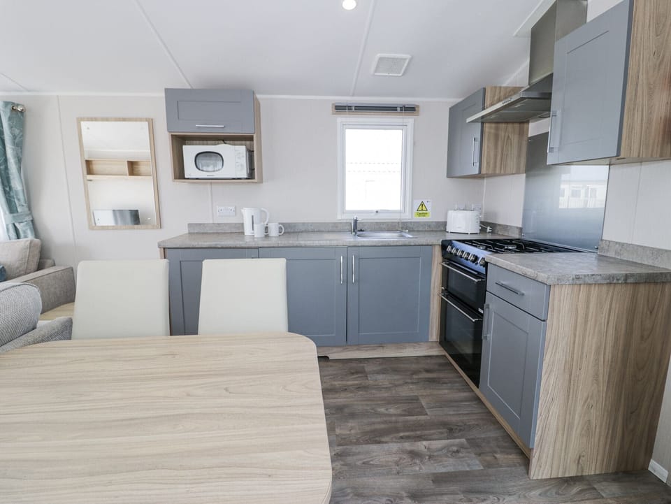 Fridge, microwave, toaster, cookware/dishes/utensils