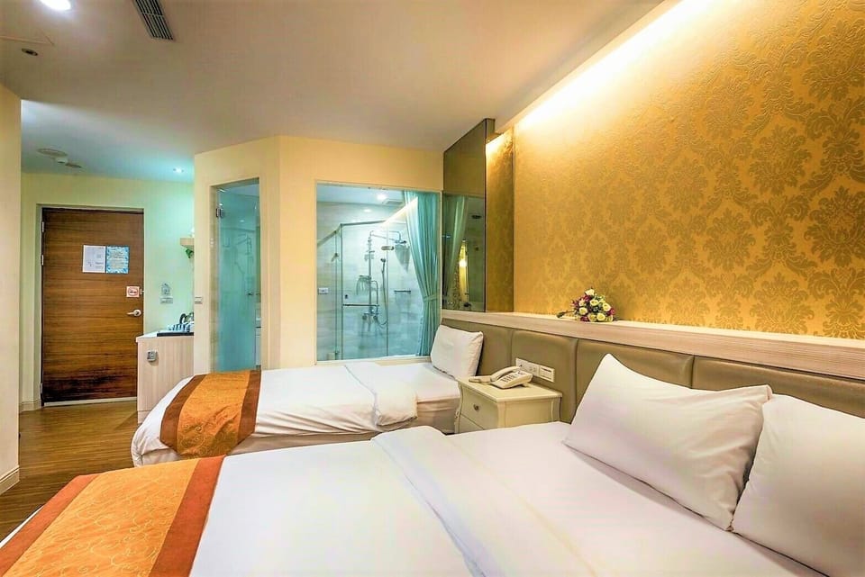 Deluxe Triple Room | Minibar, in-room safe, desk, blackout drapes