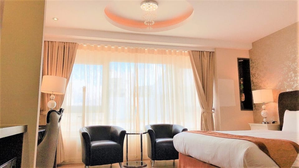 Deluxe Quadruple Room (Family room) | Minibar, in-room safe, desk, blackout drapes