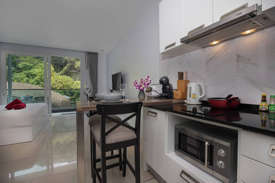 Exclusive Apartment, Balcony, Pool View | Private kitchen | Electric kettle
