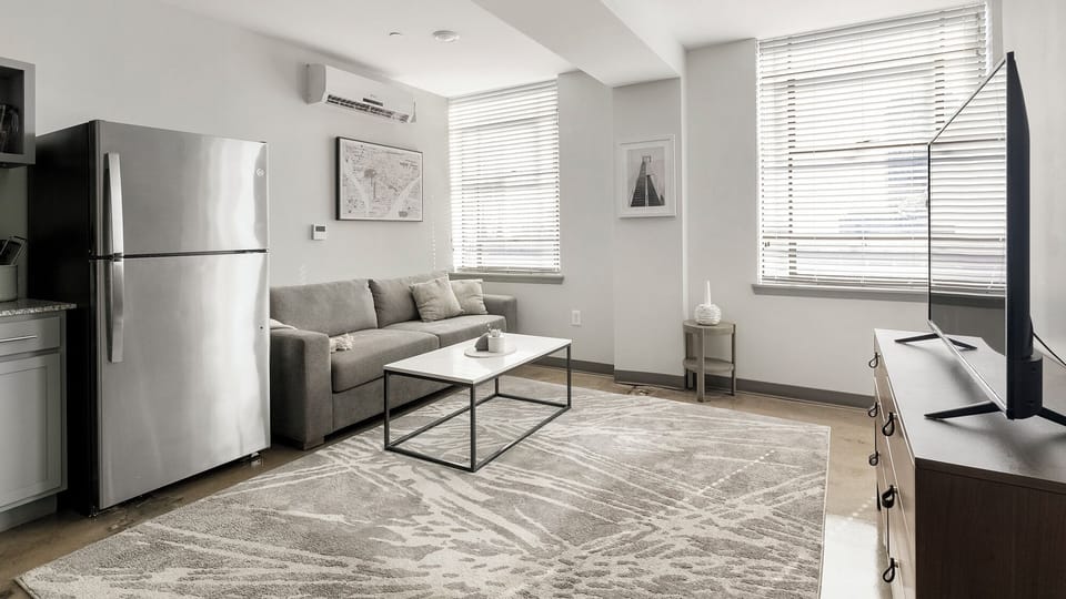 Apartment, 1 Bedroom | Living area | 50-inch TV with digital channels