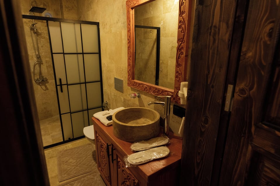 Family Suite | Bathroom | Hair dryer, slippers, heated floors, towels