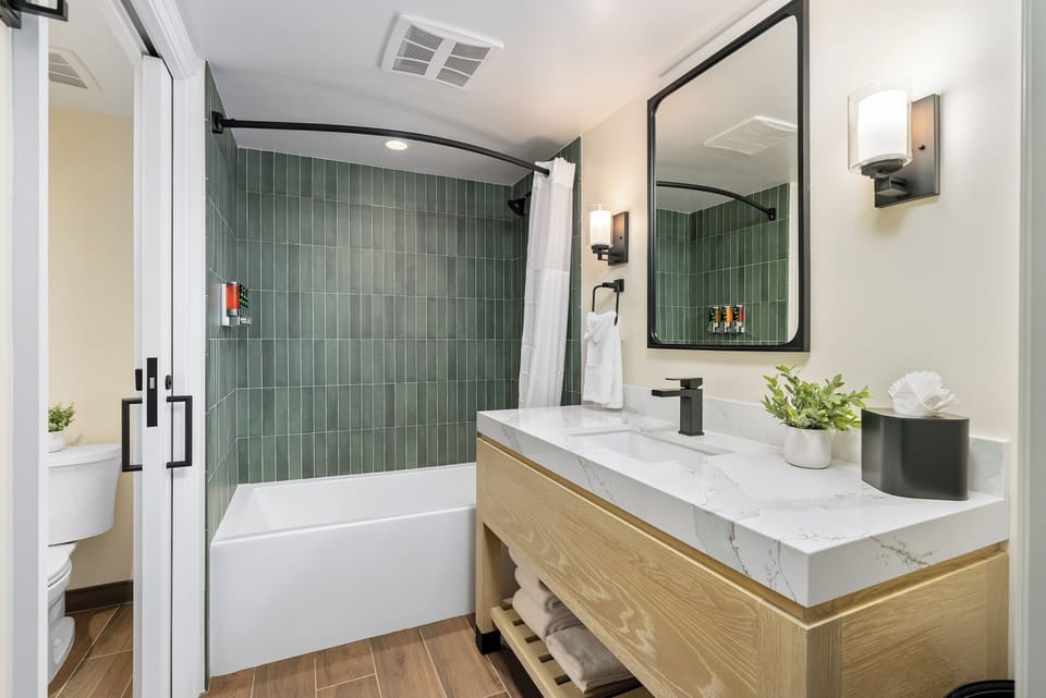 Double Queen | Bathroom | Eco-friendly toiletries, hair dryer, bathrobes, towels