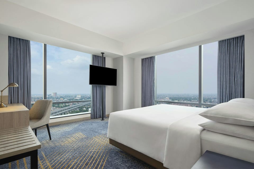 Junior Suite, 1 King Bed (View) | Premium bedding, in-room safe, desk, iron/ironing board