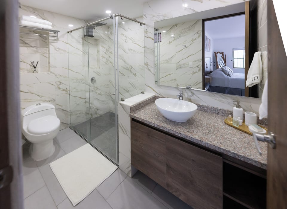Deluxe Double Room, 1 King Bed with Sofa bed, Balcony, Pool View | Bathroom | Shower, rainfall showerhead, free toiletries, towels