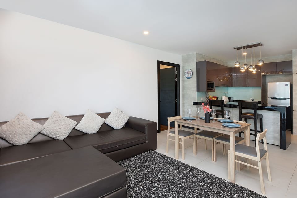 Family Apartment, 2 Bedrooms, Balcony, Garden View | Living area | 32-inch flat-screen TV with cable channels