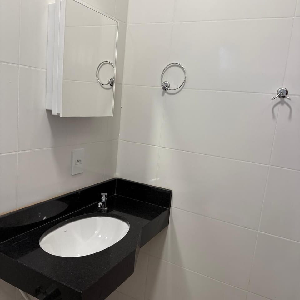 Basic Triple Room, Lanai, Courtyard View | Bathroom | Shower, towels, toilet paper