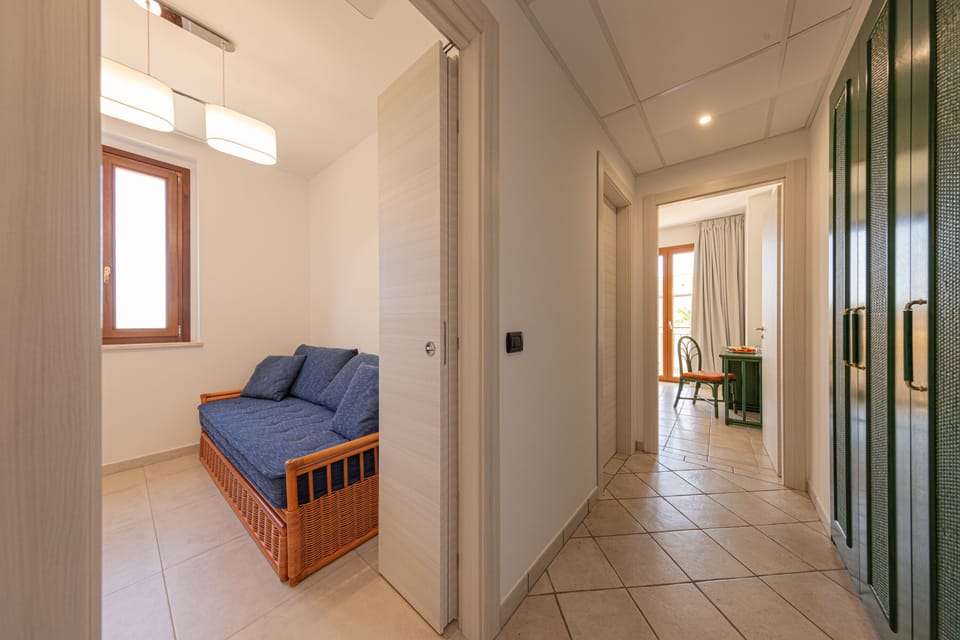 Classic Triple Room | Minibar, in-room safe, desk, laptop workspace