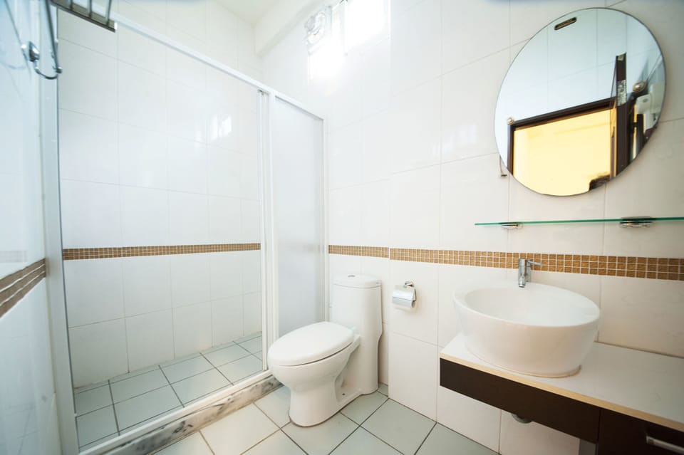 Shower, free toiletries, hair dryer, slippers