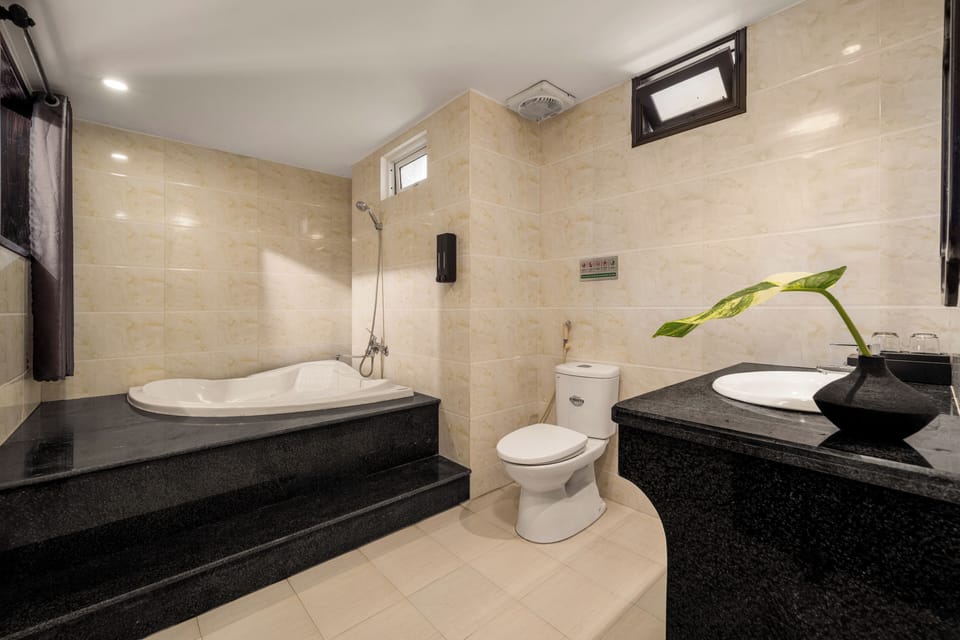 Deluxe Studio | Bathroom | Hair dryer, towels, soap, shampoo