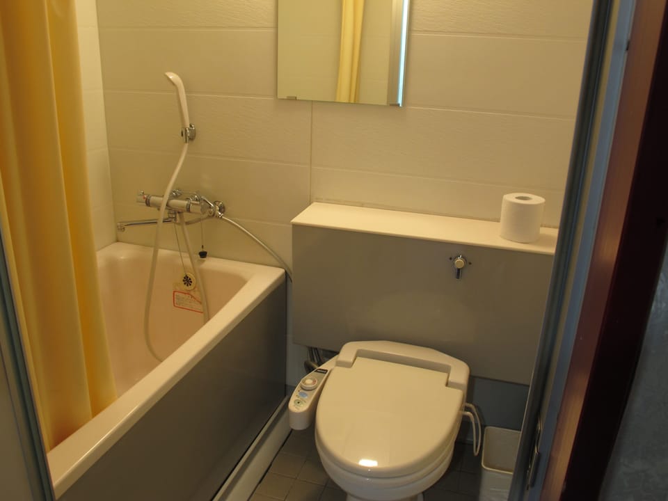 Twin Room, 2 Bedrooms | Bathroom | Combined shower/tub, deep soaking tub, free toiletries, hair dryer