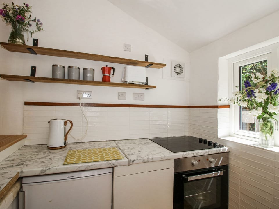 Fridge, toaster, cookware/dishes/utensils