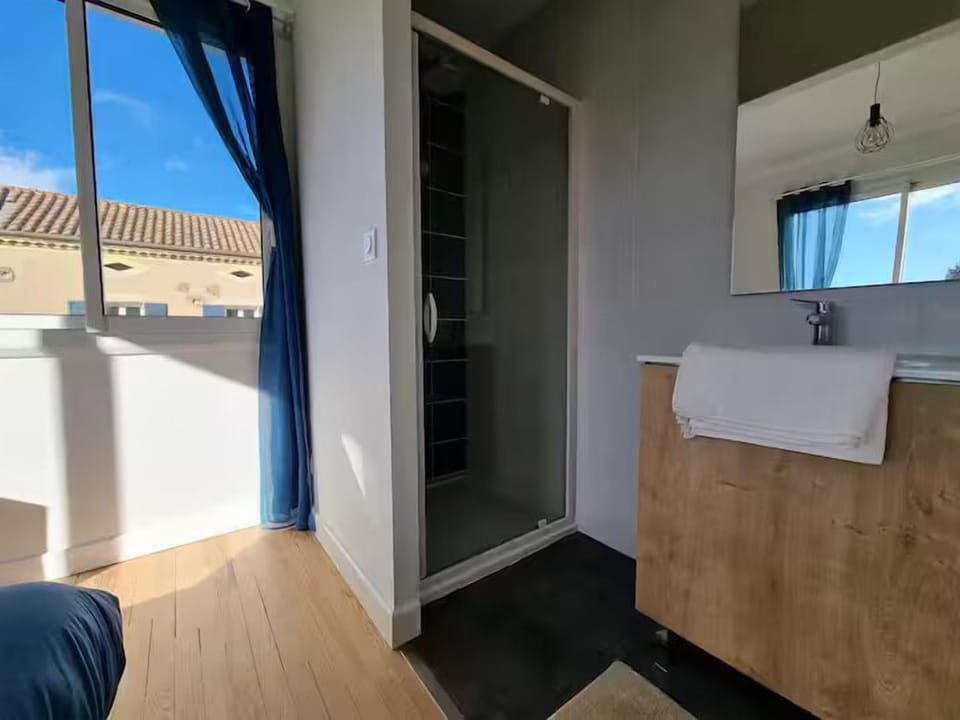 Shower, rainfall showerhead, hair dryer, towels