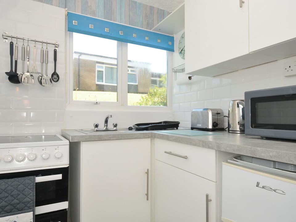 Fridge, microwave, toaster, cookware/dishes/utensils
